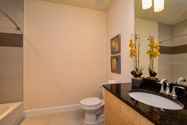 full bathroom with baseboards, visible vents, vanity, and toilet