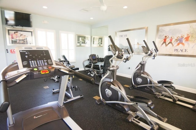 workout area featuring baseboards and recessed lighting