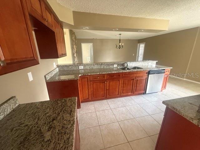 kitchen featuring stone countertops, light tile patterned flooring, a sink, dishwasher, and brown cabinetry