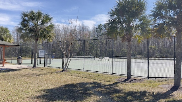 view of sport court featuring fence
