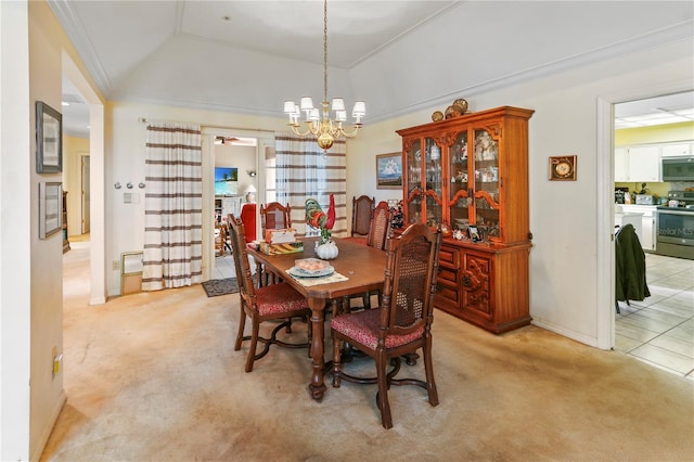 dining area with crown molding, baseboards, light colored carpet, lofted ceiling, and a notable chandelier