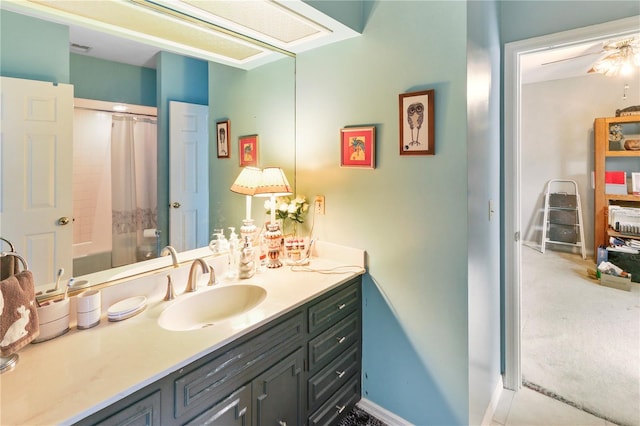 full bathroom with baseboards, a shower with curtain, and vanity