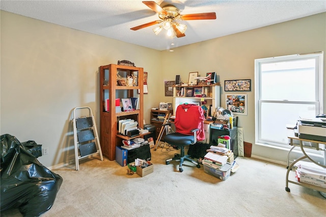 carpeted office with a wealth of natural light, baseboards, and ceiling fan