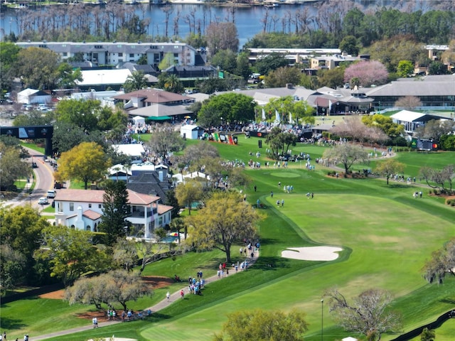 bird's eye view with a water view and view of golf course