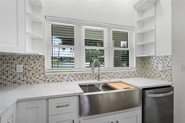 kitchen featuring light stone countertops, white cabinetry, backsplash, and open shelves