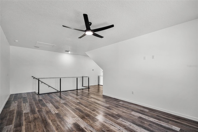 bonus room with visible vents, a ceiling fan, a textured ceiling, wood finished floors, and baseboards