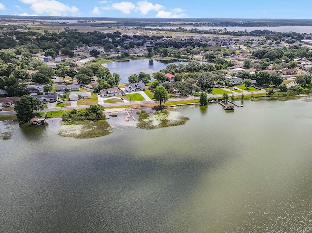 birds eye view of property featuring a water view and a residential view