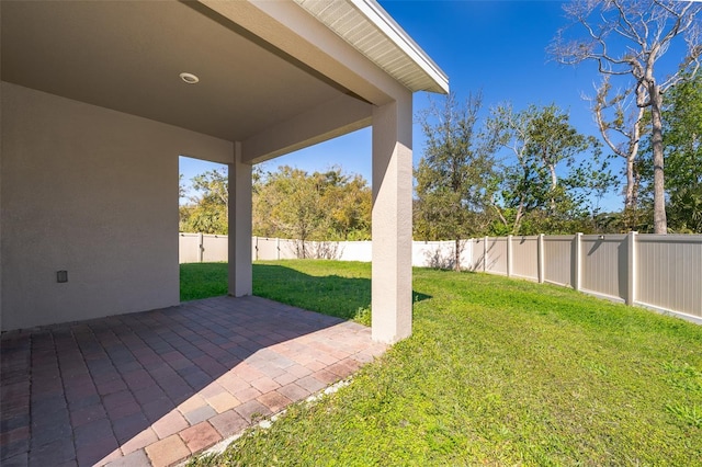 view of yard with a fenced backyard and a patio