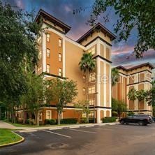 view of building exterior featuring uncovered parking