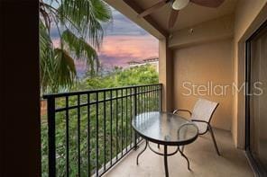 balcony at dusk with a ceiling fan