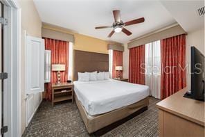 bedroom featuring ceiling fan and visible vents