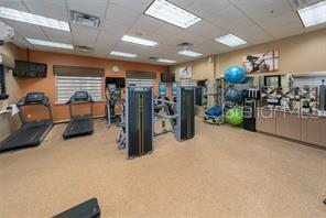 exercise room with a drop ceiling