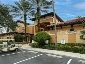 view of property featuring uncovered parking