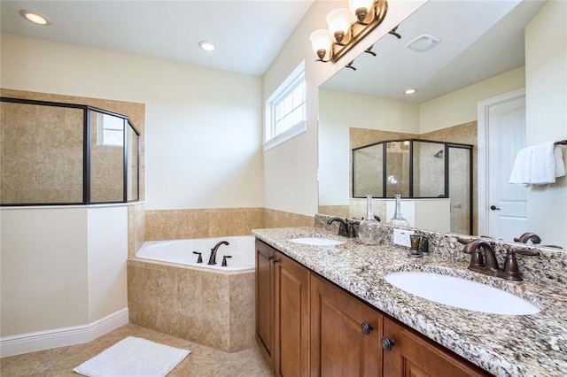 bathroom with a bath, a stall shower, a sink, and tile patterned floors