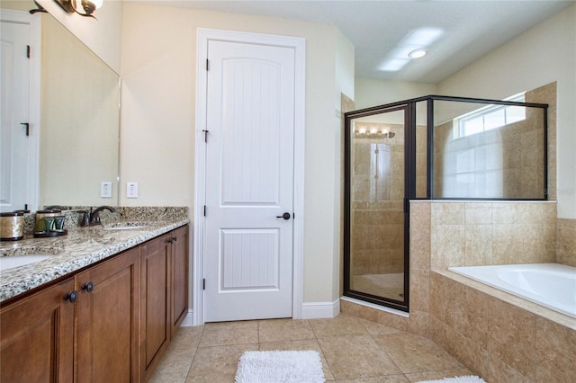 bathroom featuring double vanity, a sink, tile patterned flooring, a shower stall, and a bath