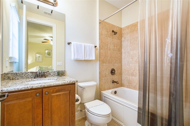 bathroom featuring shower / bath combo, visible vents, a ceiling fan, toilet, and vanity