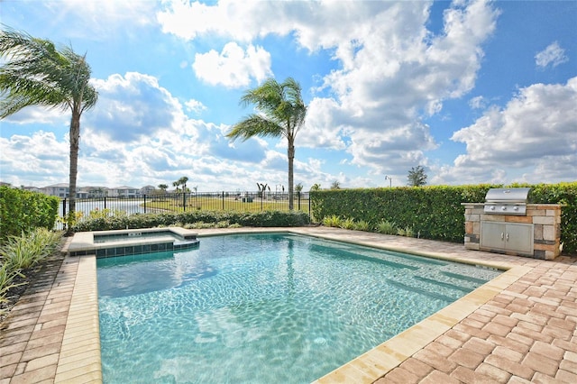 view of swimming pool featuring a fenced in pool, a fenced backyard, grilling area, exterior kitchen, and a patio area