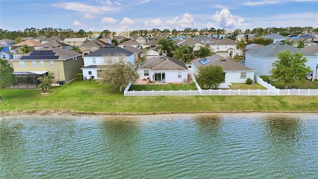 water view with fence private yard and a residential view