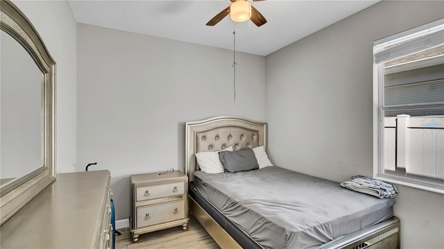 bedroom featuring a ceiling fan and light wood-style floors