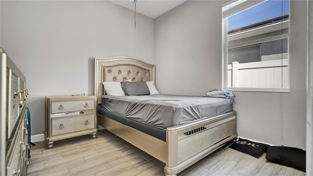 bedroom featuring light wood-style floors