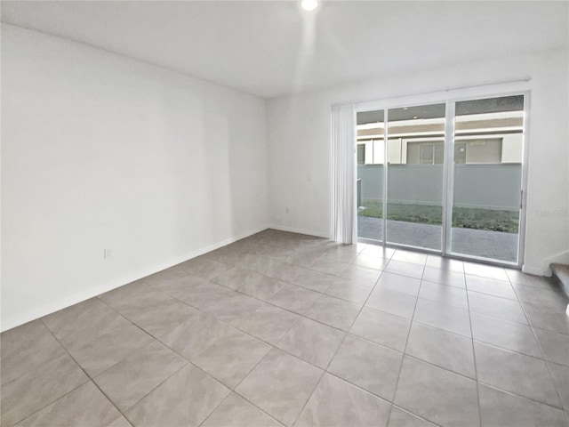 tiled empty room with baseboards