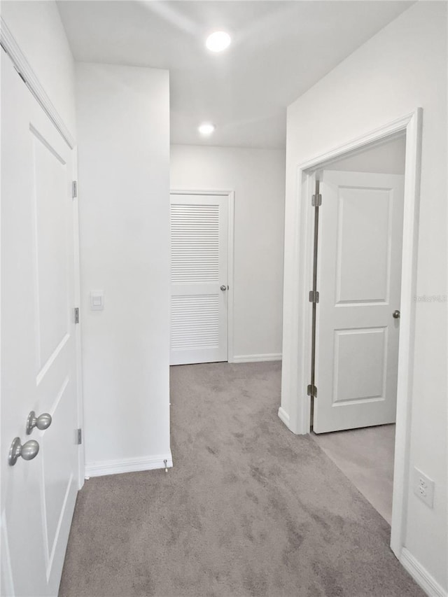 hall featuring recessed lighting, carpet flooring, and baseboards