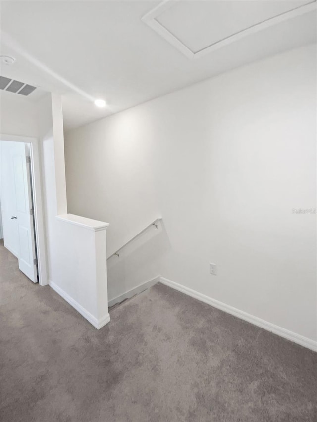 interior space featuring carpet, visible vents, and baseboards