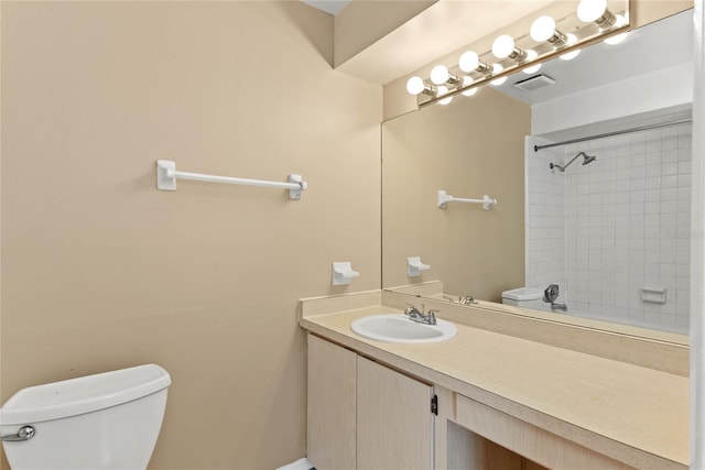 full bathroom with visible vents, vanity, and toilet