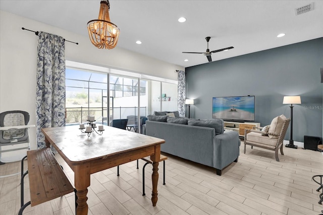 dining room featuring recessed lighting, visible vents, ceiling fan with notable chandelier, and light wood finished floors