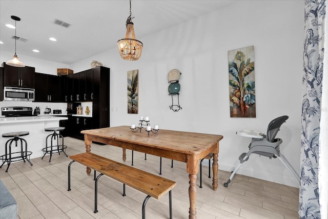 dining space with wood finish floors, visible vents, baseboards, and recessed lighting