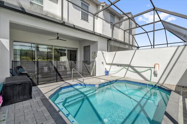 pool with ceiling fan, a patio, and a lanai