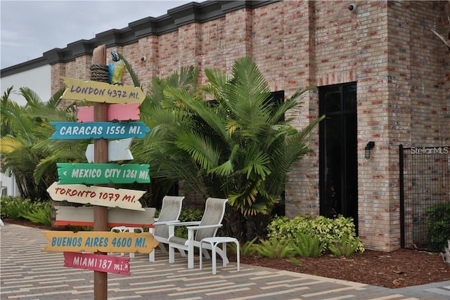 exterior space featuring brick siding