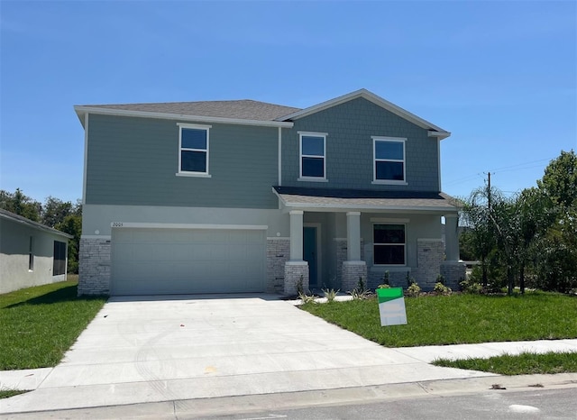 2005 Canton Park Dr, Winter Haven, FL 33881 - view of front of house featuring an attached garage, stone siding, a porch, a front yard, and concrete driveway