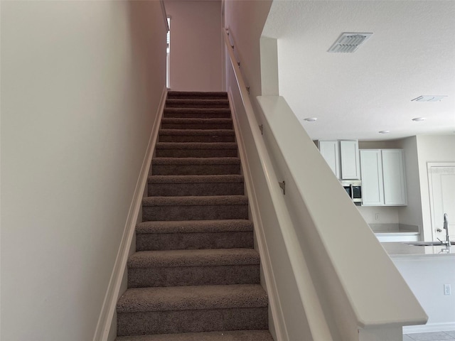 2005 Canton Park Dr, Winter Haven, FL 33881 - staircase with visible vents, recessed lighting, and baseboards