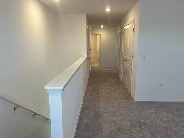 2005 Canton Park Dr, Winter Haven, FL 33881 - hallway with carpet floors, baseboards, and an upstairs landing