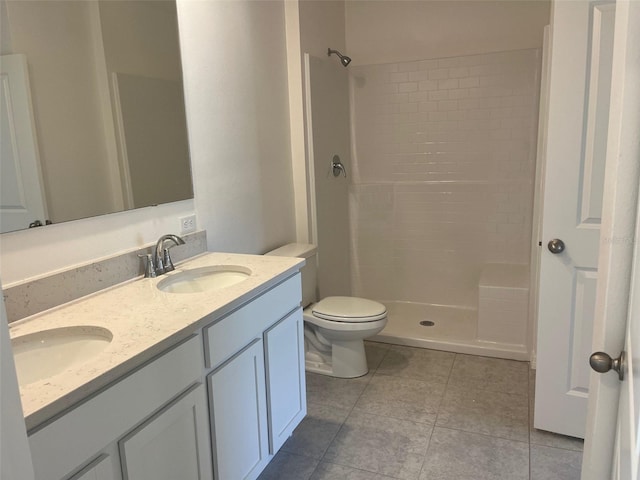 2005 Canton Park Dr, Winter Haven, FL 33881 - bathroom with a sink, tile patterned floors, a tile shower, and toilet