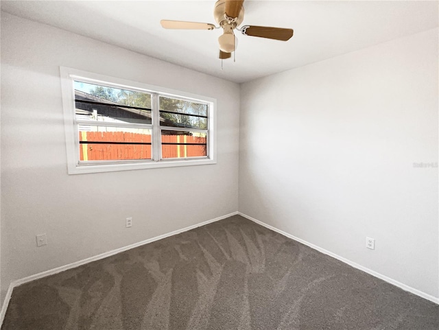 empty room featuring ceiling fan, baseboards, and carpet flooring