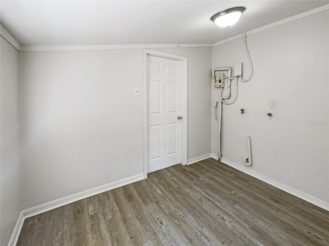 interior space with baseboards, ornamental molding, and wood finished floors