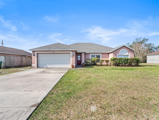 ranch-style house with an attached garage, fence, driveway, stucco siding, and a front yard