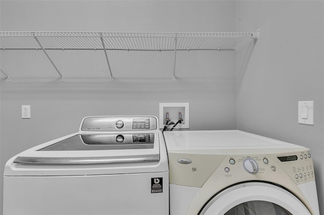 laundry area with washing machine and dryer