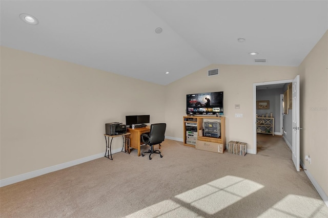 office space featuring light carpet, baseboards, visible vents, and vaulted ceiling