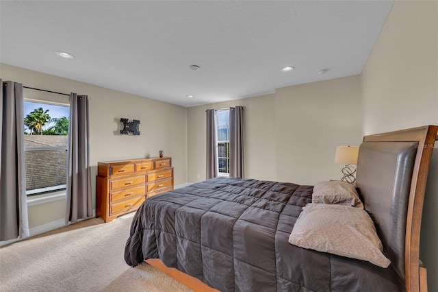 bedroom with baseboards, carpet, and recessed lighting