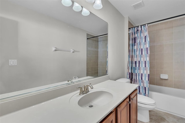 bathroom featuring toilet, vanity, visible vents, tile patterned floors, and shower / bath combo