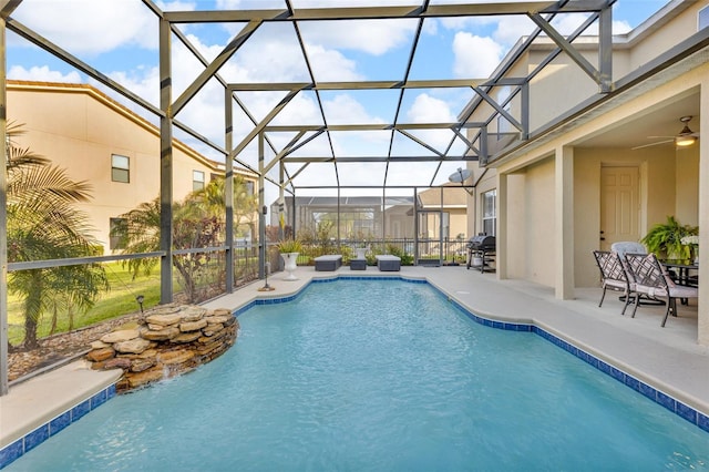 outdoor pool featuring a lanai, a patio, area for grilling, and ceiling fan