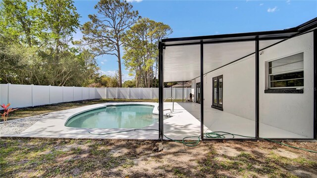 view of swimming pool with a patio area, a fenced backyard, and a fenced in pool