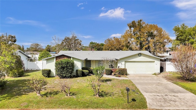 ranch-style house with a front yard, concrete driveway, fence, and an attached garage