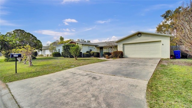 single story home featuring an attached garage, a front lawn, and concrete driveway