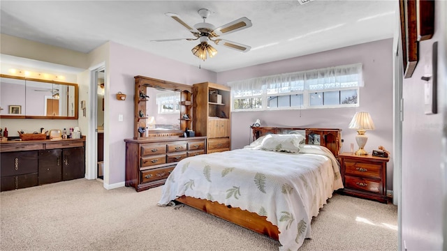 carpeted bedroom featuring a ceiling fan and baseboards