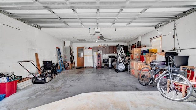 garage featuring a garage door opener and refrigerator