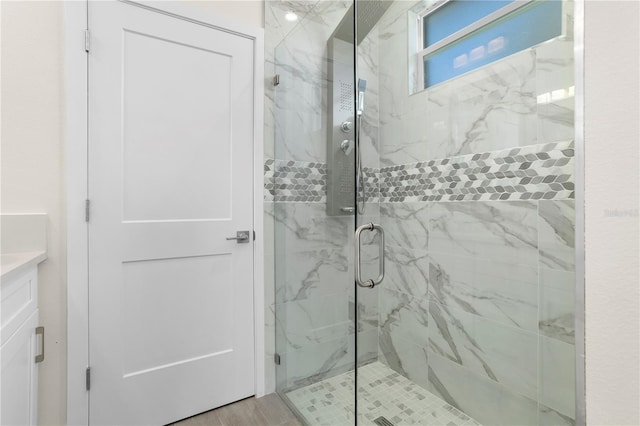 full bath with a marble finish shower